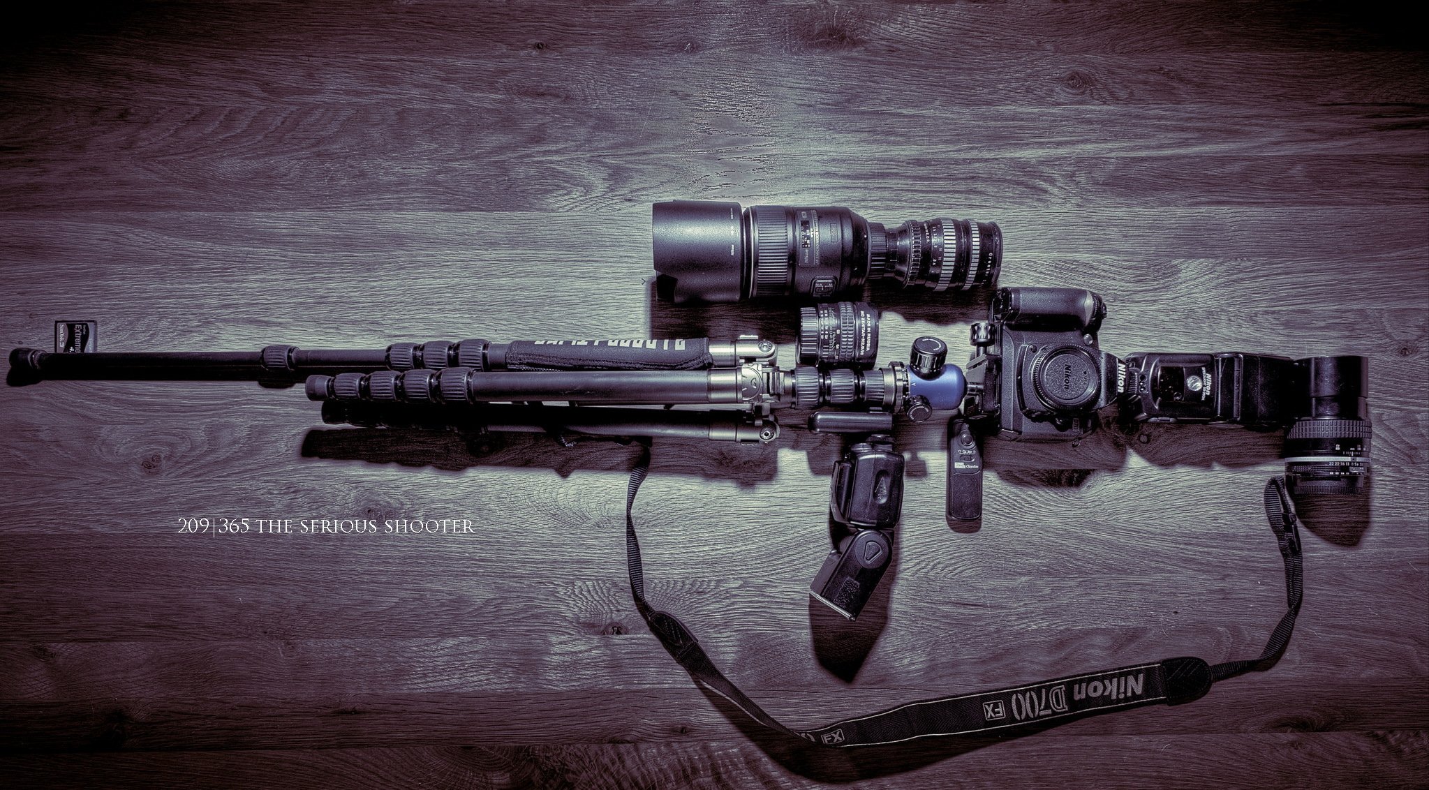 cámara trípode armas