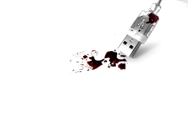 La sangre fluye del usb sobre un fondo blanco