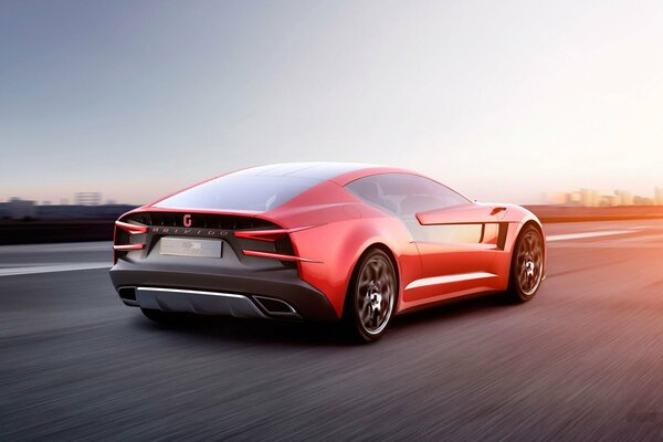 Super coche rojo a la velocidad en la carretera
