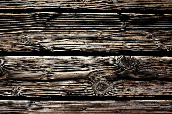 Revestimiento de madera vieja en colores negro y marrón