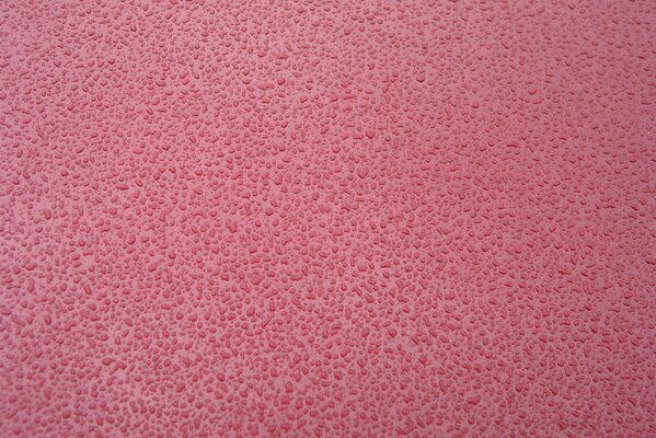 Hermoso fondo rosa de textura con gotas