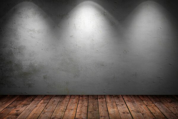 La textura de la pared gris se ilumina con luz