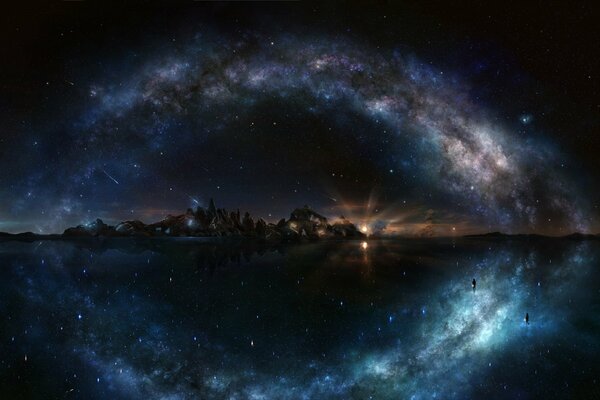 La belleza del cielo estrellado sobre el agua y las rocas