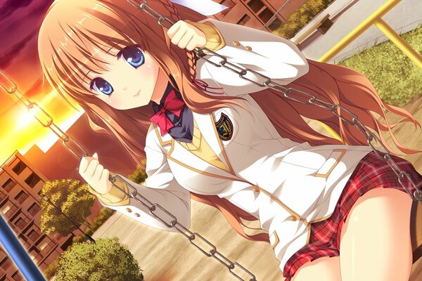 Chica en uniforme escolar en un columpio