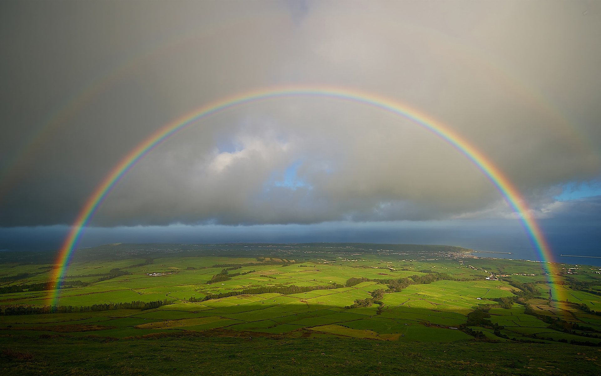 arco iris cielo mar