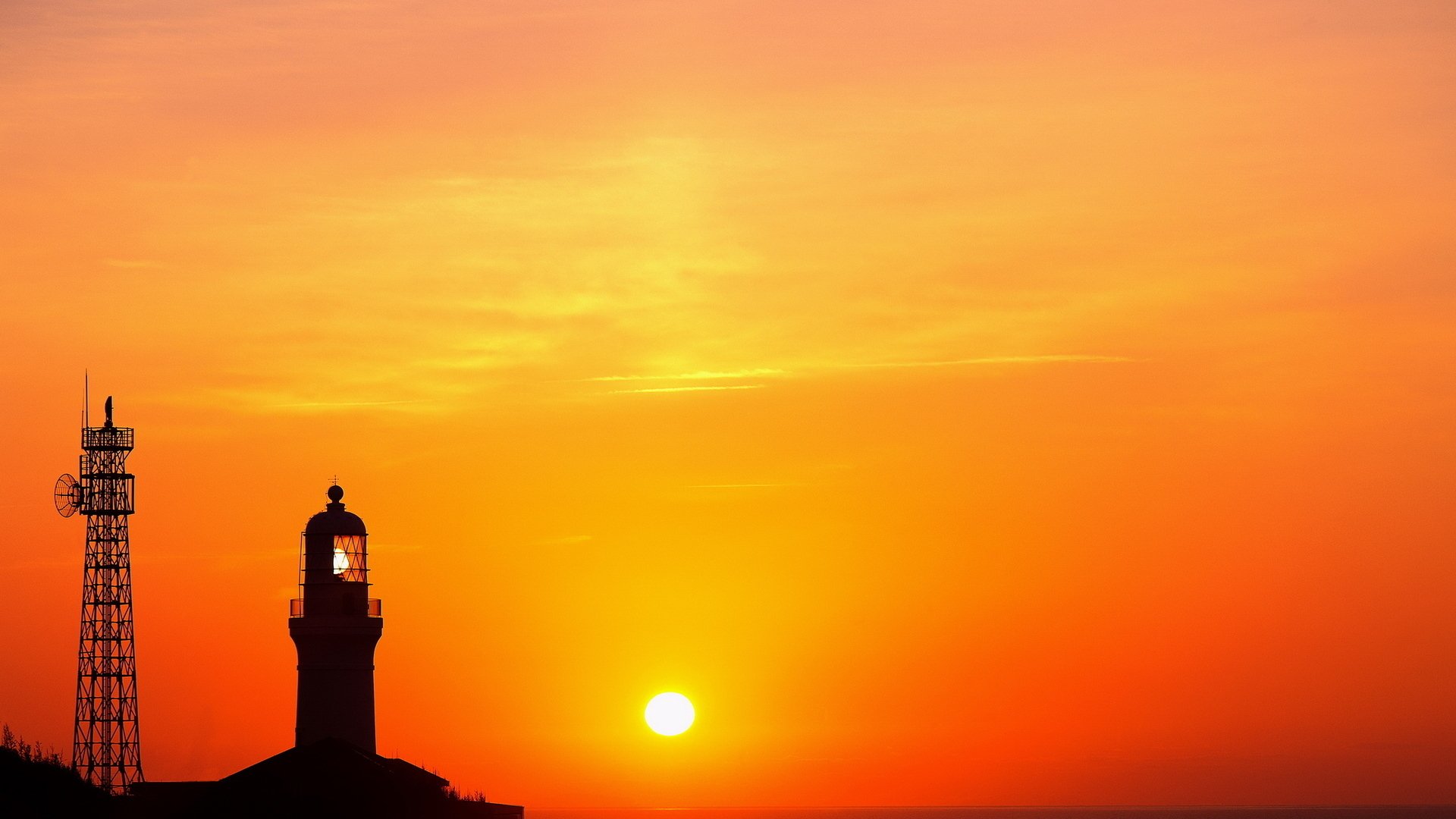 faro torre sol cielo nubes